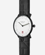 popup|Gerahmtes Datum in Rot|Dieses kleine Detail ist eine Hommage an die rote Tür des Bauhaus Gebäude in Dessau.